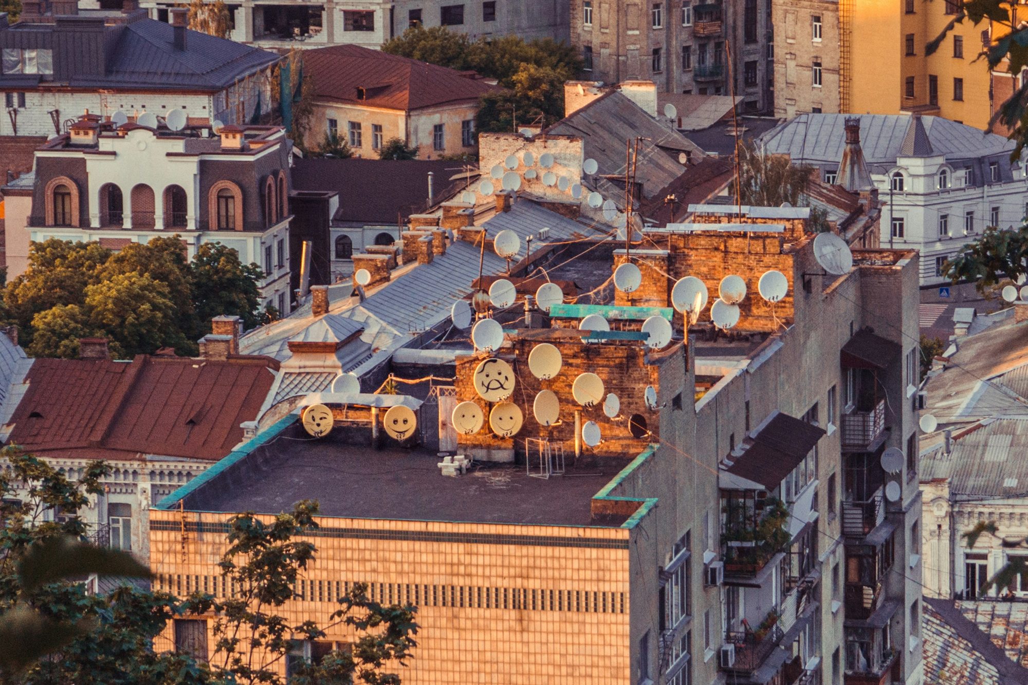 Rooftops crowded with satellite dishes and antennas